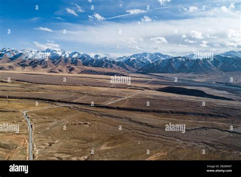 aerial view of the curved Qilian mountain road Stock Photo - Alamy