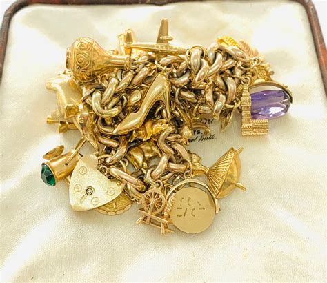 Superb heavy vintage 9ct gold charm bracelet with 29 charms ...