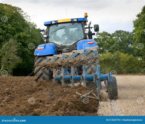 Tractor Ploughing Field Rear View Stock Photo - Image: 21254770