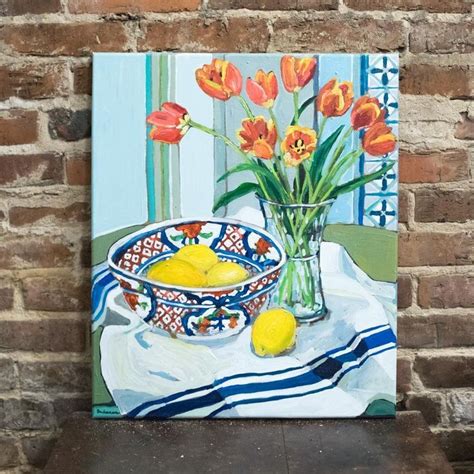 a painting of orange flowers in a bowl and lemons on a tablecloth with ...