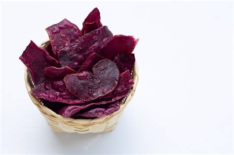 Premium Photo | Purple sweet potato chips on white surface