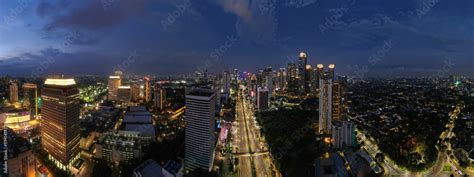 aerial shoot of Jakarta skyline during the golden hour. Jakarta is the ...