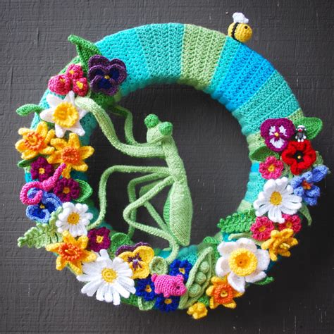 Happy Spring! Inspired by Attic24 Easter Wreath with additional flowers and bugs both knitted ...