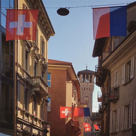 The beautiful old town of Bellinzona with its flags and late afternoon ...