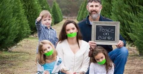 Family slammed for 'offensive' Christmas photo where mum and daughters are gagged with duct tape ...