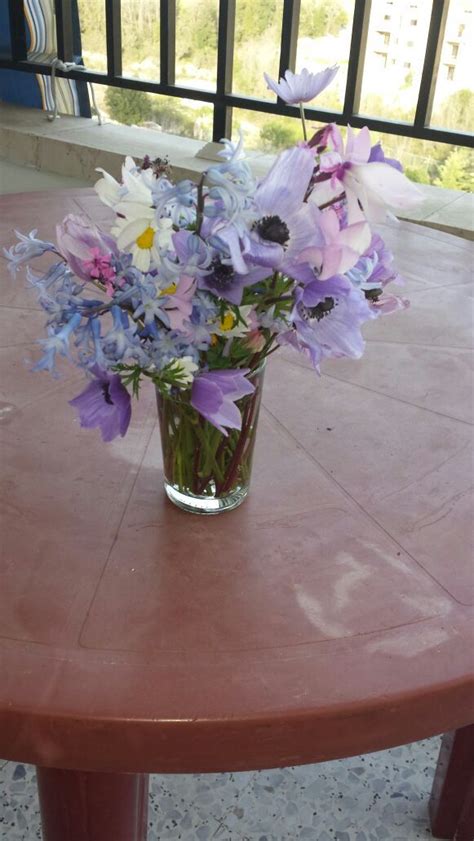 Purple and White Flower Arrangement in Glass Vase