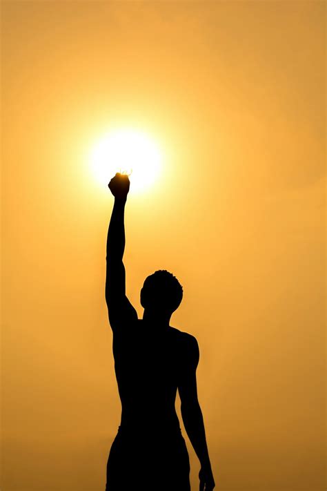 Silhouette of man against sunset sky · Free Stock Photo