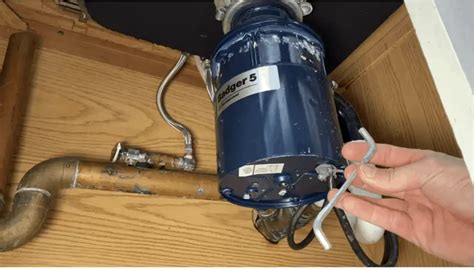 How to Repair or Replace a Garbage Disposal: Steps, Cost & More