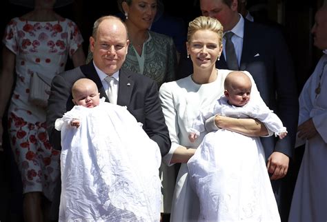 Prince Albert II of Monaco and his wife Princess Charlene hold their twins Prince Jacques and ...