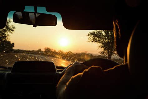 Man Driving Car At Sunset Photograph by Alexandra Simone - Fine Art America