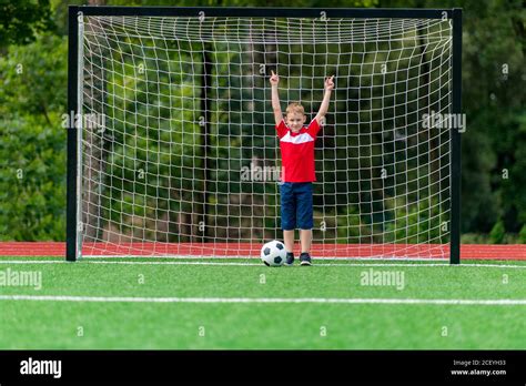 Football soccer training for kids. Young boy improving soccer skills ...