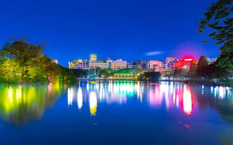 Hanoi City Old Quarters Lake At Night Glowing With Vibrant Colourful ...