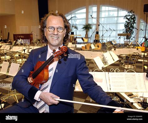 (dpa) - Dutch star violinist Andre Rieu holds a violin while standing in his studio in ...