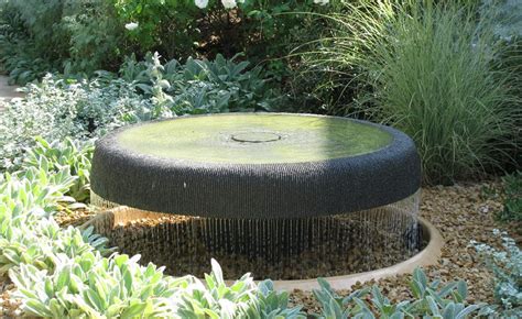 Idea for a perfect shallow bird bath fountain. If a few sprayers could ...