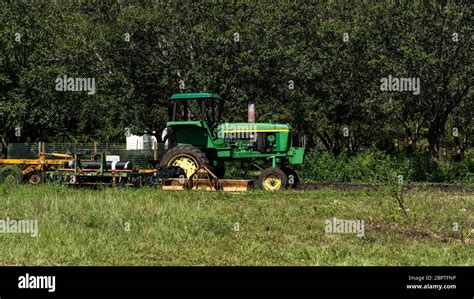 Green tractor on the farm Stock Photo - Alamy