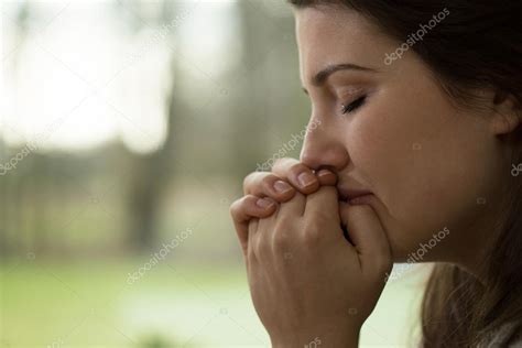 Depressed young woman crying Stock Photo by ©photographee.eu 76918803