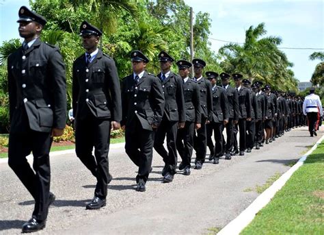 Members of the Jamaica Fire Brigade in the funeral procession en route ...