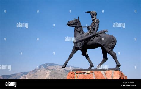 Bronze statue over grave of western character Jeremiah Liver Eating Johnson Old Trail Town Cody ...