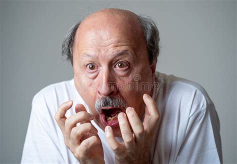 Close Up of Scared and Shocked Senior Man Gesturing in Fear with Hands and Face Stock Photo ...