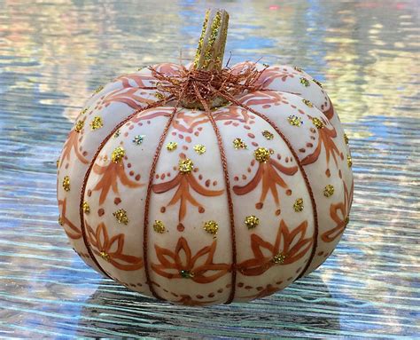 Small pumpkin decorated with metallic thread, acrylic paint, tacky glue, and micro glitter ...