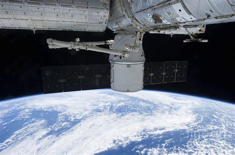 Spacex Dragon During Its Docking Photograph by Stocktrek Images | Fine ...