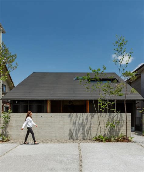 gabled roof with extended eaves tops hearth architects' hikone house in japan