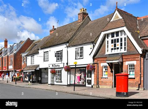 Billericay shopping high street with small retail business shop front window display & historic ...