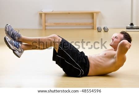 Man Doing Sit Ups In Health Club Stock Photo 48554596 : Shutterstock