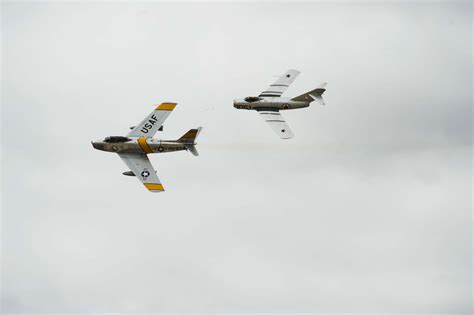 An F-86 Sabre and a MiG-15 aircraft simulate a dogfight - NARA & DVIDS ...