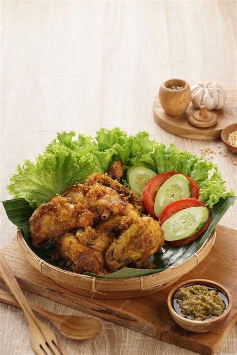 Premium Photo | Ayam Goreng Serundeng or Chicken Fried with Coconut Shredded