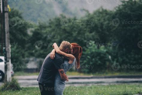 beautiful couple hugging in the rain 11781577 Stock Photo at Vecteezy