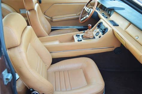 the interior of a car with leather seats