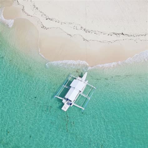 Daku Island - Siargao | Daku Island - Siargao Surrounded by crystal-clear water, Daku Island is ...