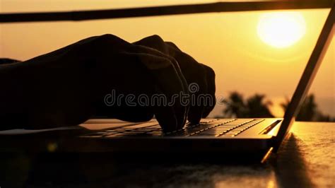 Close-up of Silhouette Male Hands Typing on Laptop at Beautiful Sunset ...