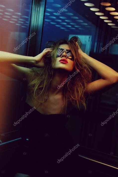 Fashionable woman in nightclub — Stock Photo © Syda_Productions #76844851