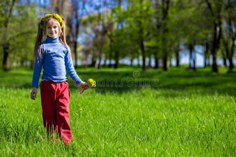 Little Girl on a Green Grass in a Wreath of Flowers in Spring Stock Photo - Image of jump ...