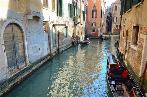 typical urban view with canal, boats and houses in Venice | Stock image | Colourbox