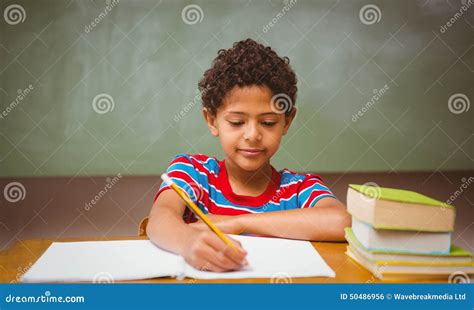 Little Boy Writing Book in Classroom Stock Photo - Image of cute, development: 50486956