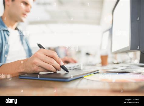 Graphic designer using a graphics tablet Stock Photo - Alamy