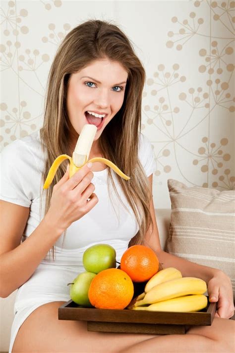 Beauty Woman is Eating Banana Stock Photo - Image of beauty, relaxing: 12802812