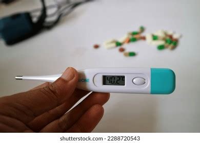 Hand Holding Thermometer High Fever Temperature Stock Photo 2288720543 ...