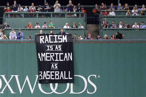 Protestors Kicked Out of Fenway Park For Unfurling "Racism Is as American as Baseball" Banner