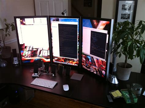 My new setup: 3 30" monitors in portrait. Great for coding… | Flickr