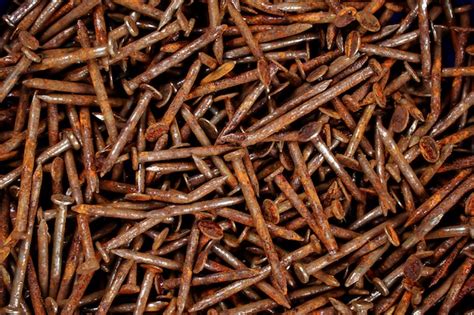 Premium Photo | Rusty nail Many rusted nails Group of Iron rust Metal surface becomes brown from ...