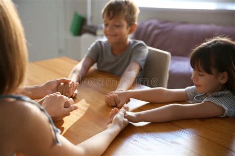 Family praying at home stock photo. Image of little - 151308640