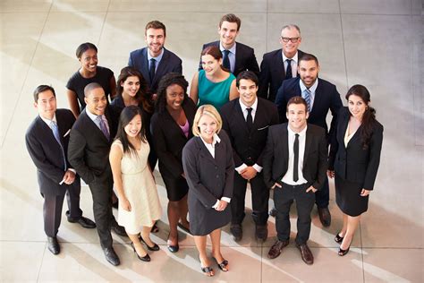 Portrait Of Multi-Cultural Office Staff Standing In Lobby - The Finch Group