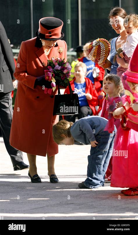 Four year old Edward Manfield makes a very low bow to Britain's Queen ...