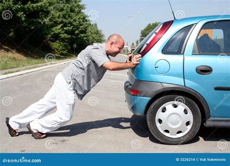 Man Pushing A Car Stock Images - Image: 3226214