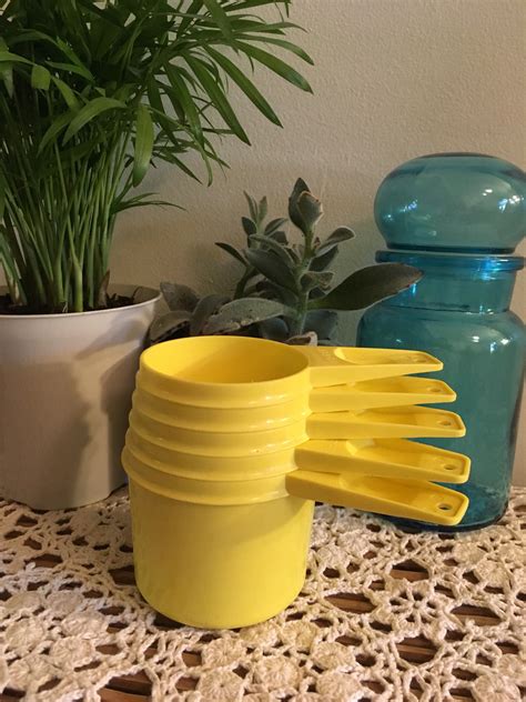 Yellow Tupperware measuring cups vintage set of five | Etsy ...