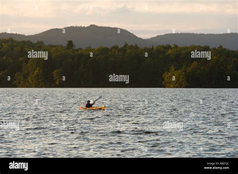 A paddler kayaking on Umbagog Lake near the Umbagog Lake State ...